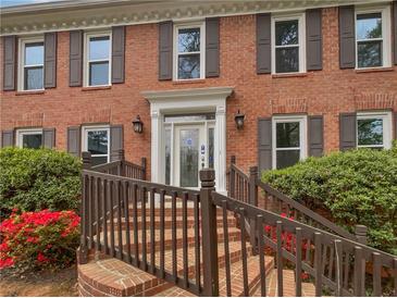 Charming brick home featuring a beautifully landscaped yard and inviting entrance at 3549 Meadow Chase Dr, Marietta, GA 30062