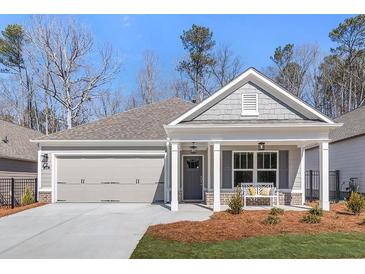 Charming single Gathering home with a welcoming front porch and a two-car garage at 1341 Cedarcrest Blvd, Acworth, GA 30101