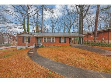 Charming brick home featuring a walkway and a covered carport at 1350 Ruth, Decatur, GA 30035