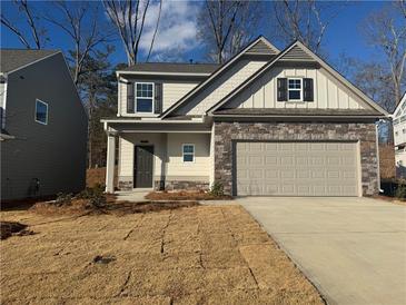 Two-story house with stone accents and a two-car garage at 372 Bloomfield Cir, Canton, GA 30114