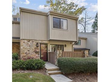 Attractive townhome with stone accents and a private fenced patio at 1260 Druid Knoll Ne Dr, Brookhaven, GA 30319