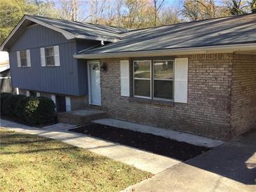 Charming single-Gathering home featuring a brick facade and inviting front entrance at 2787 Heritage Ln, Morrow, GA 30260