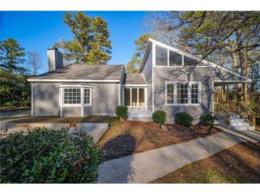 Newly renovated gray house with updated landscaping at 6724 Oakland Dr, Douglasville, GA 30135