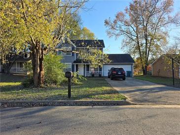 Two-story house with driveway, landscaping, and a mailbox at 476 Brookfield Way, Jonesboro, GA 30238