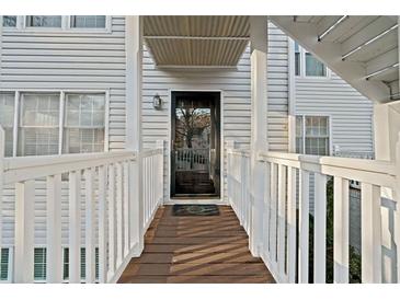 Inviting entryway featuring a raised walkway and classic black front door at 1115 Cannongate Sw Xing, Marietta, GA 30064