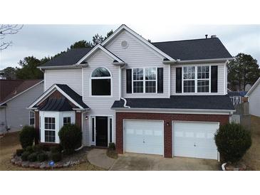 Charming two-story home with a two car garage and lovely architectural features at 1255 Silverstone Trl, Jonesboro, GA 30238