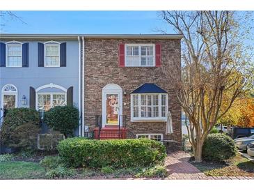 Brick front townhouse with a charming bay window and well-manicured landscaping at 260 Manning Sw Rd # 62, Marietta, GA 30064