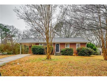 Brick ranch house with carport and mature trees at 4685 Ruby Ln, Forest Park, GA 30297