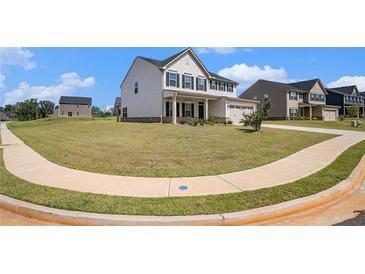 Charming two-story home with a spacious front yard and inviting curb appeal at 467 Daffodil Ln, Mcdonough, GA 30253