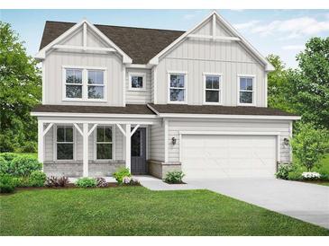 Two-story farmhouse-style home with covered porch and attached two-car garage at 67 Rocking Wood Vw, Dallas, GA 30157