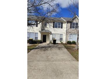 Charming townhouse with a well-maintained front yard and a classic design at 2438 Brianna Dr, Hampton, GA 30228