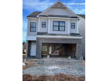 Two-story home with gray siding, brick accents, and a two-car garage at 1059 Crest Mill Dr, Marietta, GA 30008