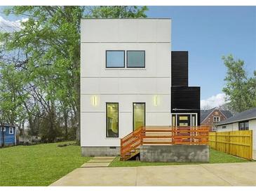 Modern two-story home with black and white exterior and wooden deck at 1073 Mayson Turner Nw Rd, Atlanta, GA 30314