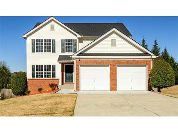 Charming two-story home featuring a two-car garage and well-maintained front yard at 1188 Pine Acre Dr, Sugar Hill, GA 30518