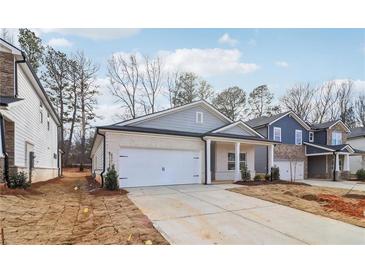 Craftsman style home with gray siding and white brick accents at 3933 Brushy St, Powder Springs, GA 30127