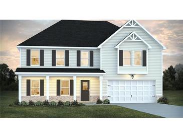 Charming two-story home features a welcoming front porch, attached garage, and manicured lawn at 1637 Fuma Leaf Way, Mcdonough, GA 30253