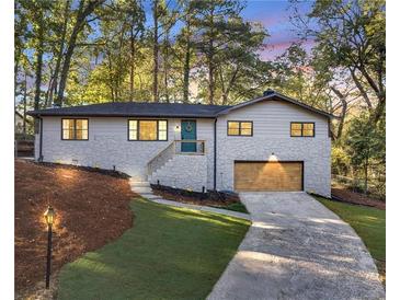 Charming ranch home with stone accents and a landscaped yard at 2873 Bob Bettis Rd, Marietta, GA 30066