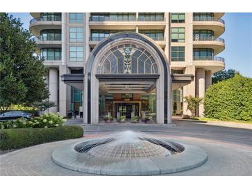 Elegant high-rise building with fountain and landscaped grounds at 750 Park Ne Ave # 13W, Atlanta, GA 30326