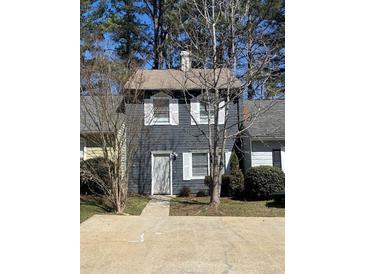 Charming townhome featuring a gray exterior, white trim, and a well-maintained front yard at 926 Westland Dr, Marietta, GA 30064