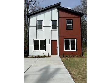 Modern two-story home with two-tone siding and a well-manicured front lawn at 1835 W Taylor Ave, East Point, GA 30344
