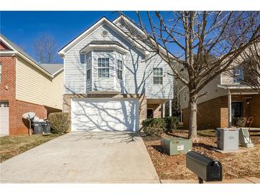 Two-story house with gray siding, attached garage, and a driveway at 604 Beaujolais Ct, Mcdonough, GA 30253