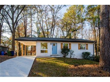 Charming single-story home with a bright blue front door and covered parking at 474 Fairlock Nw Ln, Atlanta, GA 30331