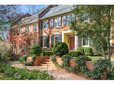Brick front of charming home with landscaping and inviting walkway at 4458 Paces Battle Nw, Atlanta, GA 30327