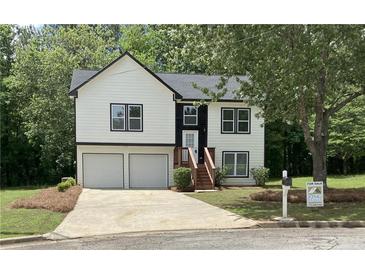 Charming two-story home featuring a two-car garage, well-manicured lawn, and inviting front entrance at 2655 Brandenberry Dr, Decatur, GA 30034