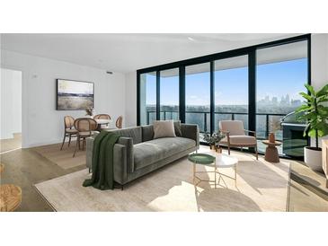 Bright living room featuring large windows with city views, modern furnishings, and neutral tones at 2425 Peachtree Ne Rd # 1106, Atlanta, GA 30305