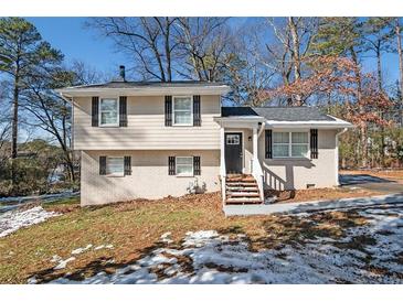 Updated ranch home features a charming exterior and landscaping at 2751 Lloyd Rd, Decatur, GA 30034