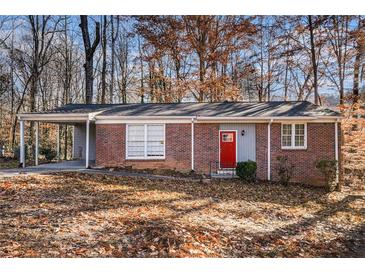 Brick ranch house with carport and red front door at 2970 Eleanor Nw Ter, Atlanta, GA 30318