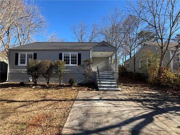 Gray house with a gray roof, steps, and small bushes in front at 854 Fayetteville Se Rd, Atlanta, GA 30316