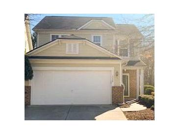 Two-story house with attached garage and landscaping at 2024 Appaloosa Way, Conyers, GA 30012