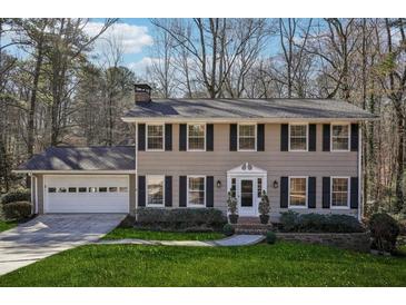 Two-story house with gray siding, black shutters, and a white front door at 2773 Townley Cir, Atlanta, GA 30340