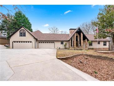 Suburban home with three-car garage and stone accents at 3355 Old Peachtree Rd, Dacula, GA 30019