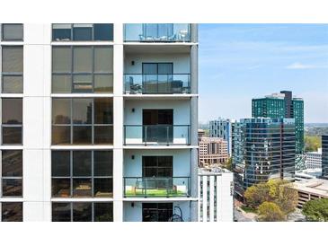 Condo exterior featuring balconies with views of the city skyline on a sunny day at 1280 W Peachtree Nw St # 3009, Atlanta, GA 30309