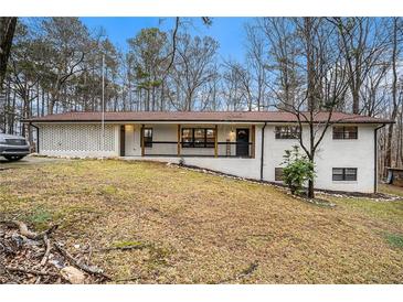 Charming ranch home with white brick exterior and covered porch at 570 N Burnt Hickory Rd, Douglasville, GA 30134