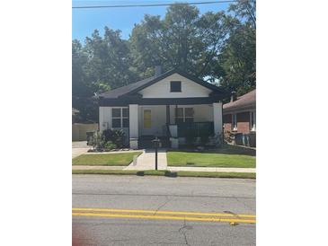 Charming renovated bungalow with a welcoming front porch at 1682 Connally Dr, Atlanta, GA 30344