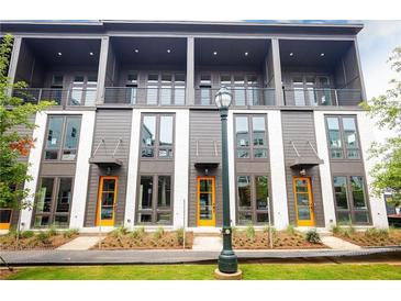 Modern townhome exterior with large windows, balconies, and colorful front doors at 462 Latta Ne St, Atlanta, GA 30308
