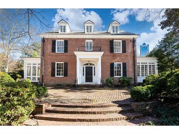 Brick Georgian home with a symmetrical facade, grand entryway, and mature landscaping at 2933 Andrews Nw Dr, Atlanta, GA 30305