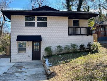 Newly renovated brick home with dark brown accents and a small front yard at 2992 1St Sw Ave, Atlanta, GA 30315