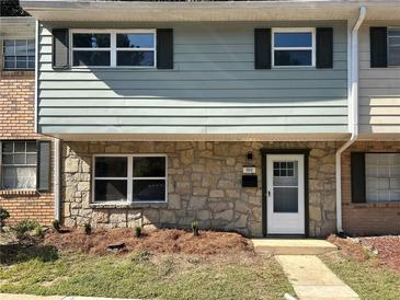 Updated townhouse exterior with stone accents and landscaping at 4701 Flat Shoals Rd # 56E, Union City, GA 30291