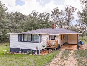 Charming one-story home with a spacious yard at 1202 Coan Dr, Locust Grove, GA 30248