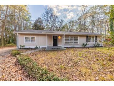 House exterior featuring a newly painted facade and landscaping at 2504 Stone Rd, Atlanta, GA 30344