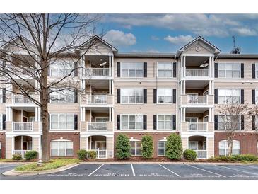 Three-story condominium building with brick and siding exterior and balconies at 4333 Dunwoody Park # 2113, Dunwoody, GA 30338