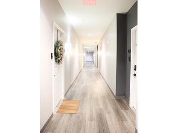 Clean and bright hallway with wood-look floors and modern lighting at 870 Mayson Turner Nw Rd # 1210, Atlanta, GA 30314