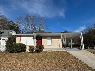Brick house with covered porch and carport at 2043 Chicago Nw Ave, Atlanta, GA 30314