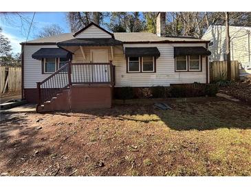 Ranch style home with front yard and steps leading to the entrance at 2669 Blount St, Atlanta, GA 30344