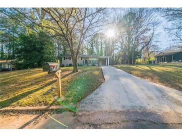 Ranch house with driveway, landscaping, and mailbox at 1583 Tanager Cir, Decatur, GA 30032