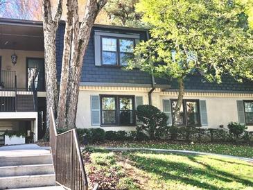 Attractive exterior of a townhouse with landscaping and walkway at 134 Amherst Nw Pl, Atlanta, GA 30327